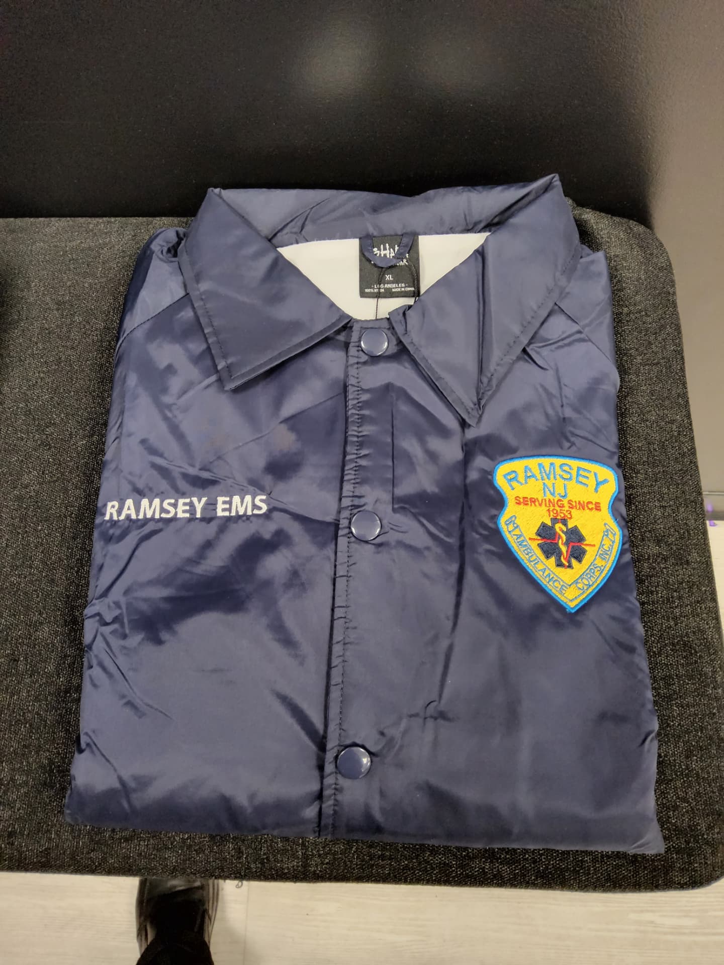 Ramsey EMS navy coach jacket with embroidered name and ambulance corps patch