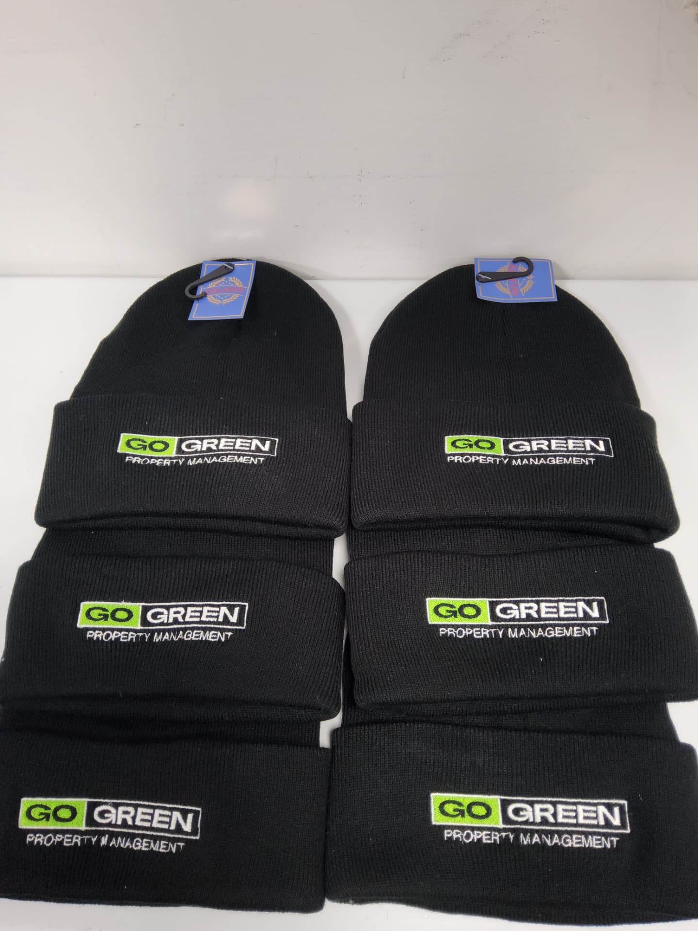Go Green Property Management embroidered black cuffed beanies